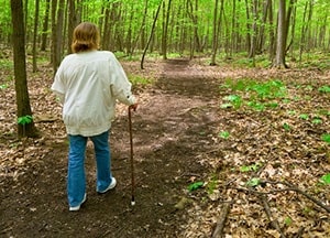 Person walking with cane